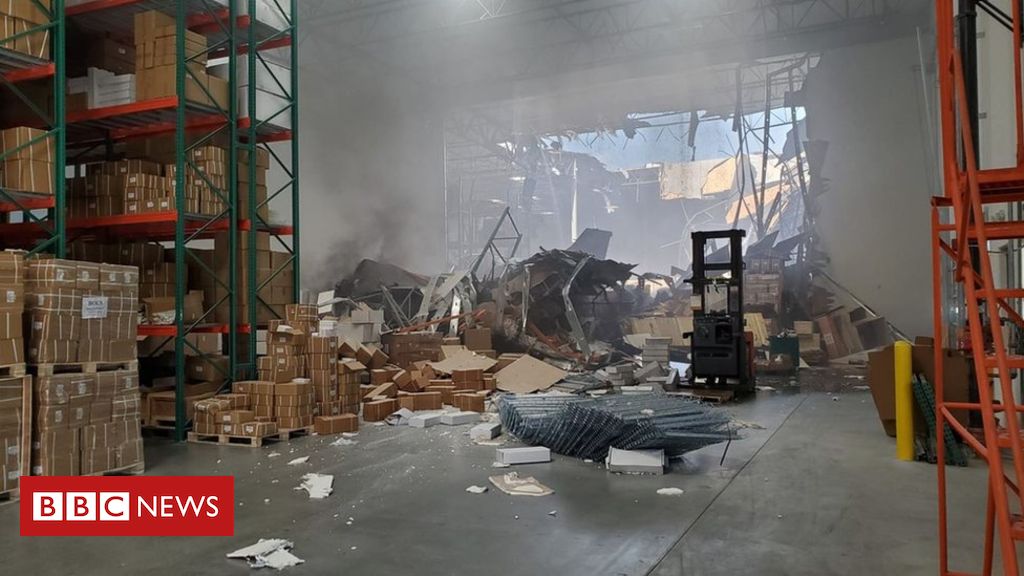 US fighter jet crashes into warehouse