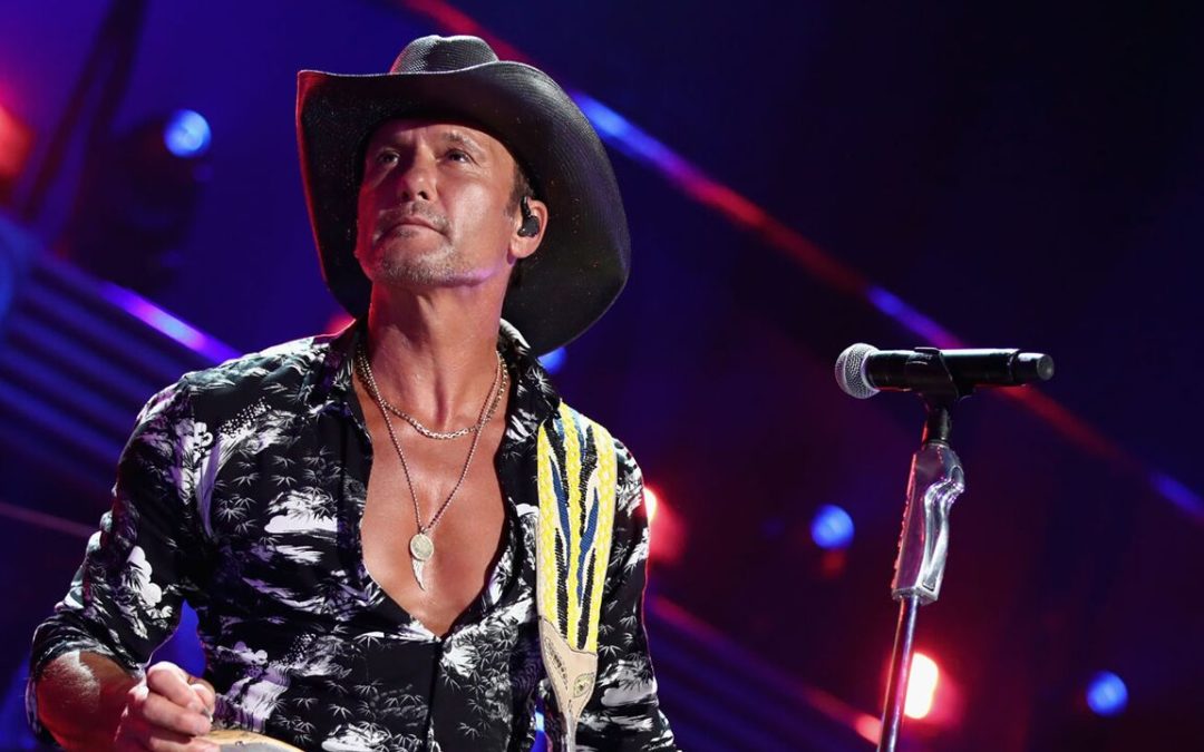 Tim McGraw shows off prized fish in shirtless pic and fans can’t help but notice his abs: ‘What fish?’