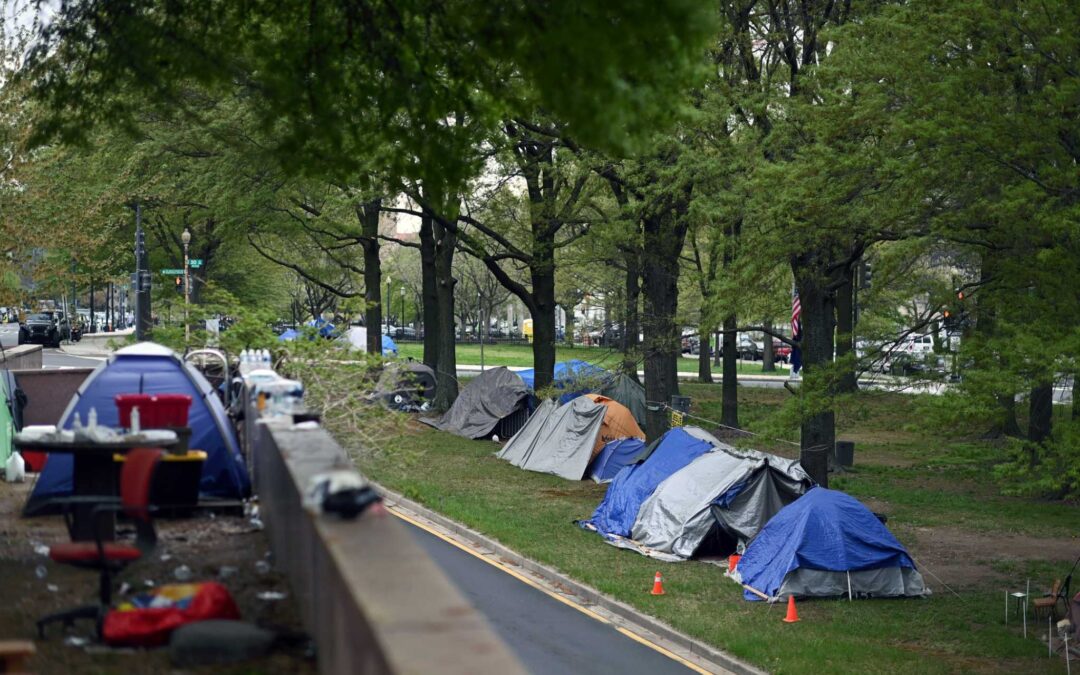 Two blocks from Federal Reserve, a growing encampment of homeless grips economy's most powerful person...
