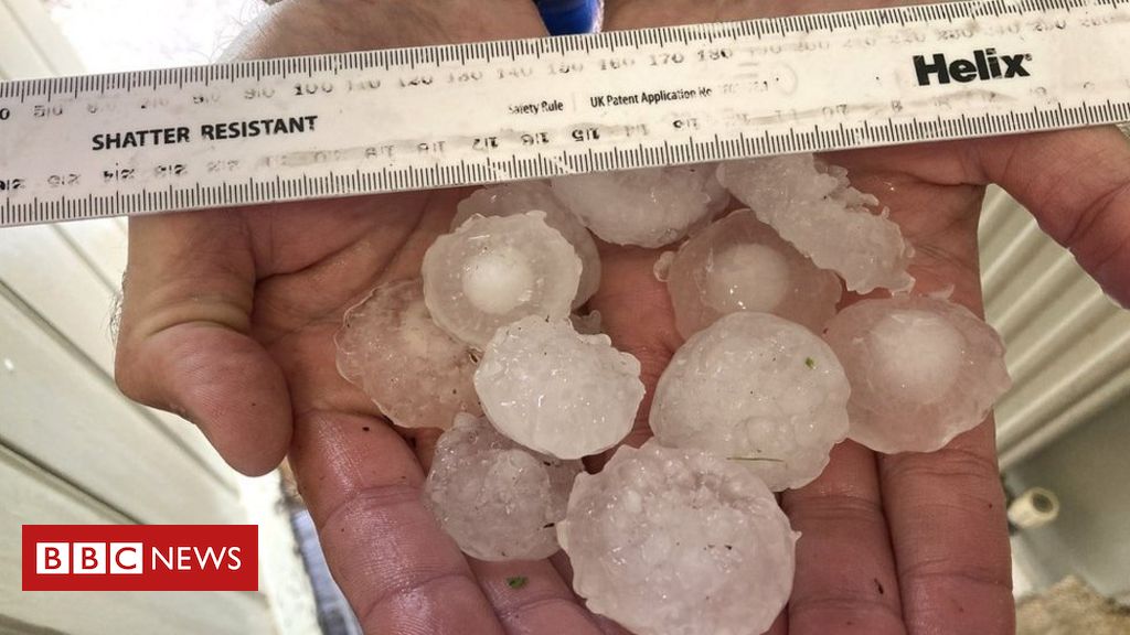Giant hail damages cars and windows in heatwave storm
