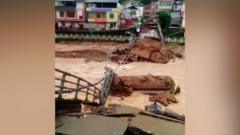 Bridge collapses as floods hit China's south