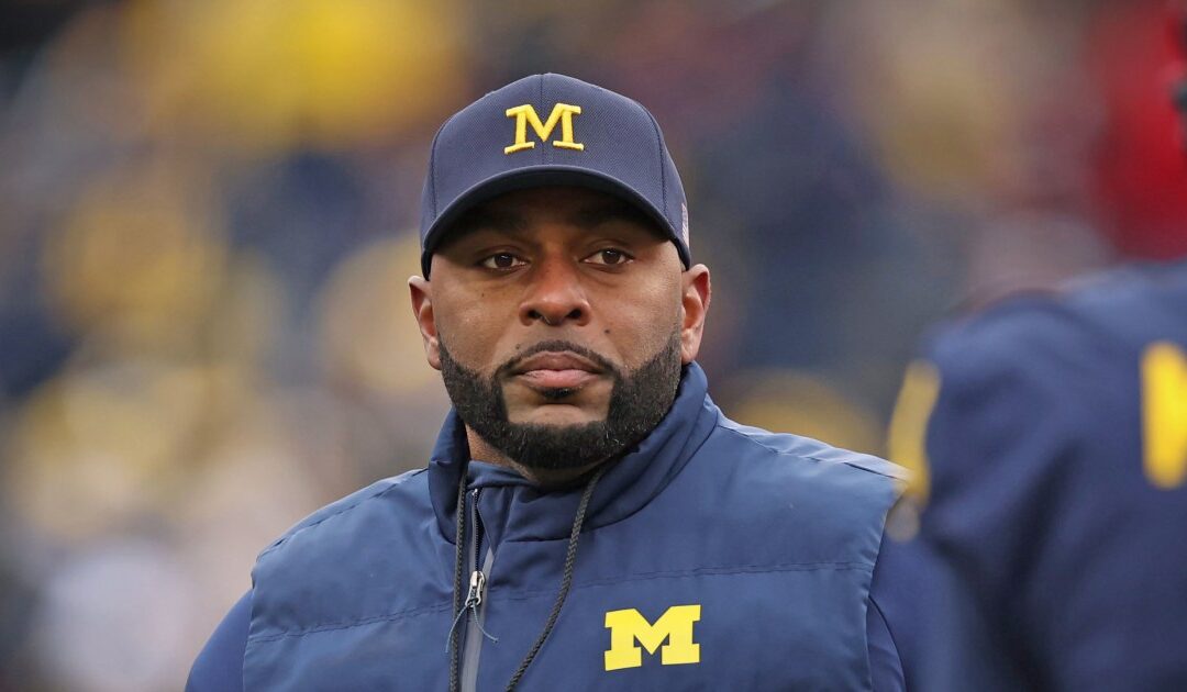 Fired MICHIGAN coach dons new uniform...