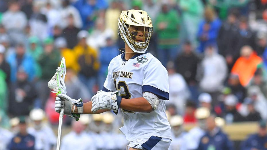 Notre Dame's Josh Yago delivers Memorial Day salute during anthem before lacrosse championship game